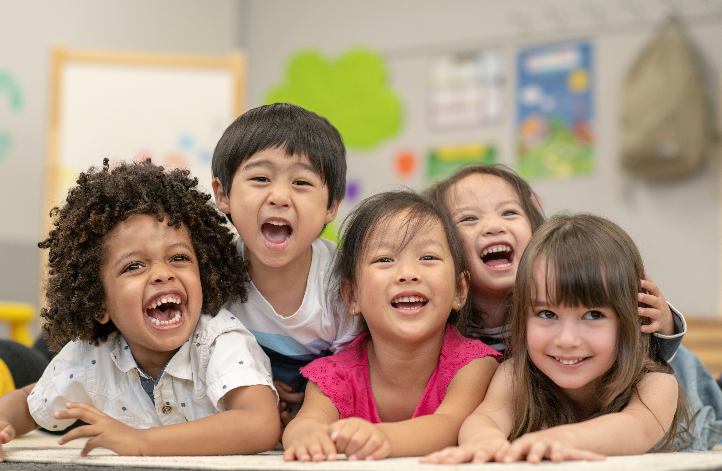 A group of smiling pre-school students